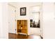 Hallway featuring a built-in bookshelf with an open doorway to a spare bedroom at 3756 E Alamo St, San Tan Valley, AZ 85140