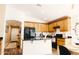 Open kitchen with granite countertops, a sink, stainless appliances, and wooden cabinets to make a functional space at 3756 E Alamo St, San Tan Valley, AZ 85140