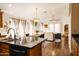 The open floor plan seamlessly connects the kitchen, dining area, and living room, perfect for modern living at 3756 E Alamo St, San Tan Valley, AZ 85140
