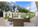 Backyard patio features a comfortable outdoor seating area, a well-maintained lawn, and tasteful landscaping at 4018 E Coolidge St, Phoenix, AZ 85018