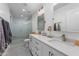 Bright bathroom with double sinks, vanity, and walk-in shower with glass door at 4018 E Coolidge St, Phoenix, AZ 85018