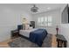 Comfortable bedroom features blue accents, plush carpet, and natural light at 4018 E Coolidge St, Phoenix, AZ 85018