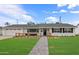 Charming single-story home with white brick and a welcoming front patio at 4018 E Coolidge St, Phoenix, AZ 85018