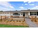 Inviting home exterior featuring a cozy front patio with modern seating at 4018 E Coolidge St, Phoenix, AZ 85018