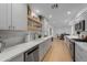 Bright kitchen features gray cabinets, stainless steel appliances, and wood floors at 4018 E Coolidge St, Phoenix, AZ 85018