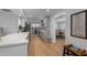 Renovated kitchen with hardwood floors, gray cabinetry, and a dining area view at 4018 E Coolidge St, Phoenix, AZ 85018