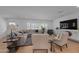 Bright living room with large windows, hardwood floors, and neutral decor at 4018 E Coolidge St, Phoenix, AZ 85018