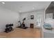 Workout room with wood floors, weights, and natural light at 4018 E Coolidge St, Phoenix, AZ 85018