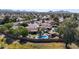 Stunning aerial view of a home with a private pool, patio, and manicured landscaping in a desirable neighborhood at 4126 E Windrose Dr, Phoenix, AZ 85032