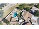 Aerial view of a backyard with a pool, desert landscaping, and the home's roof at 4126 E Windrose Dr, Phoenix, AZ 85032