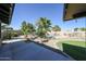 Lush backyard oasis with swimming pool, tropical plants and ample space for entertaining and relaxation at 4126 E Windrose Dr, Phoenix, AZ 85032