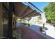 Expansive patio with shade cover, overlooking a pristine backyard, a perfect setting for entertaining or relaxing at 4126 E Windrose Dr, Phoenix, AZ 85032