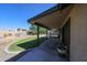 Covered back patio with lush yard, pool view, and a refreshing outdoor living space at 4126 E Windrose Dr, Phoenix, AZ 85032