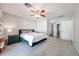 Comfortable bedroom featuring carpet flooring, a ceiling fan, and a serene atmosphere at 4126 E Windrose Dr, Phoenix, AZ 85032