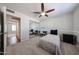 Cozy bedroom with ceiling fan, closet with mirrored doors, and a well-lit study area at 4126 E Windrose Dr, Phoenix, AZ 85032