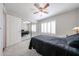 Comfortable bedroom with ceiling fan, plantation shutters and closet with mirrored doors at 4126 E Windrose Dr, Phoenix, AZ 85032