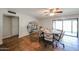 Dining area featuring tile flooring, a modern table, and access to the backyard area at 4126 E Windrose Dr, Phoenix, AZ 85032