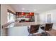 Kitchen featuring granite counters, stainless steel appliances, and dark cherry cabinetry at 4126 E Windrose Dr, Phoenix, AZ 85032
