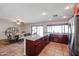 Open-concept kitchen featuring granite counters, stainless steel appliances, and a nearby dining area at 4126 E Windrose Dr, Phoenix, AZ 85032