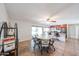 Open-concept kitchen featuring granite counters, stainless steel appliances, and a nearby dining area at 4126 E Windrose Dr, Phoenix, AZ 85032