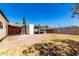 View of a large backyard featuring brick pavers and various outdoor structures at 4147 W Reade Ave, Phoenix, AZ 85019