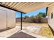 View of the backyard with a covered patio and brick paver hardscape at 4147 W Reade Ave, Phoenix, AZ 85019