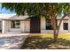 Charming single-story home features a well-maintained lawn and inviting front entrance at 4147 W Reade Ave, Phoenix, AZ 85019