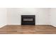 Living room with wood floors and modern fireplace at 4147 W Reade Ave, Phoenix, AZ 85019