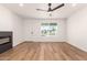 Bright living room featuring wood floors, a ceiling fan and ample natural light at 4147 W Reade Ave, Phoenix, AZ 85019