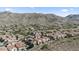 Scenic aerial of community with desert landscaping and mountain views at 421 W Mountain Sage Dr, Phoenix, AZ 85045
