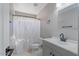 Bathroom with a single sink vanity, modern fixtures, tile flooring and shower curtain at 421 W Mountain Sage Dr, Phoenix, AZ 85045