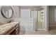 Bathroom showing a bathtub, separate shower, and granite countertops at 421 W Mountain Sage Dr, Phoenix, AZ 85045