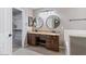 Bathroom features double sinks, granite countertops, and a vanity area at 421 W Mountain Sage Dr, Phoenix, AZ 85045