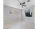 Spacious bedroom featuring a ceiling fan, tile floors, neutral walls, and a large window at 421 W Mountain Sage Dr, Phoenix, AZ 85045