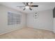 Bedroom featuring a large window and a digital clock on the wall at 421 W Mountain Sage Dr, Phoenix, AZ 85045