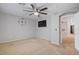 Bedroom boasts gray walls, brown carpet, and a modern ceiling fan at 421 W Mountain Sage Dr, Phoenix, AZ 85045