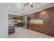 Well-equipped kitchen featuring stainless steel appliances, granite countertops, and tile flooring at 421 W Mountain Sage Dr, Phoenix, AZ 85045