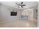 An open living room featuring tile flooring, and easy access to the kitchen, with ample space at 421 W Mountain Sage Dr, Phoenix, AZ 85045