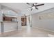 View of the living room with open-concept layout, leading into the kitchen area with tile floors at 421 W Mountain Sage Dr, Phoenix, AZ 85045