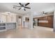 Open-concept living space with tile floors, stylish arches, and seamless flow to the kitchen at 421 W Mountain Sage Dr, Phoenix, AZ 85045