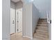 Carpeted stairs lead to the upper level with neutral paint and white trim at 421 W Mountain Sage Dr, Phoenix, AZ 85045