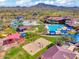 Aerial view of the community's water park and recreation center, surrounded by scenic mountains at 43510 N 44Th Ave, New River, AZ 85087