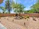 Well-maintained backyard showcasing desert landscaping and a paved patio area with lounge seating at 43510 N 44Th Ave, New River, AZ 85087
