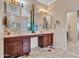 Large bathroom with double sinks, a vanity area, and decorative accents at 43510 N 44Th Ave, New River, AZ 85087
