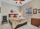 Comfortable bedroom featuring neutral tones, a ceiling fan, and a window with blinds at 43510 N 44Th Ave, New River, AZ 85087