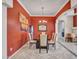 Formal dining room with elegant lighting, wainscotting, and stylish decor creates a perfect space for entertaining guests at 43510 N 44Th Ave, New River, AZ 85087