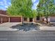 Charming single-story home with a well-maintained lawn and mature trees providing shade and curb appeal at 43510 N 44Th Ave, New River, AZ 85087
