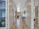 Inviting hallway featuring tile flooring, neutral paint, and decorative mirror, creating a warm and welcoming entrance at 43510 N 44Th Ave, New River, AZ 85087