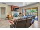 Cozy living room featuring a fireplace, comfortable seating, and sliding glass doors leading to the outdoor patio at 43510 N 44Th Ave, New River, AZ 85087