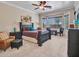 The primary bedroom includes sitting area, ceiling fan, a large window and ample room at 43510 N 44Th Ave, New River, AZ 85087